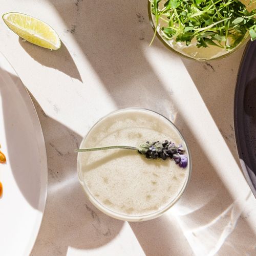 Delicious dishes: a steak plate with veggies, a creamy dessert drink, and a shellfish-topped plate with greens and vibrant sides.